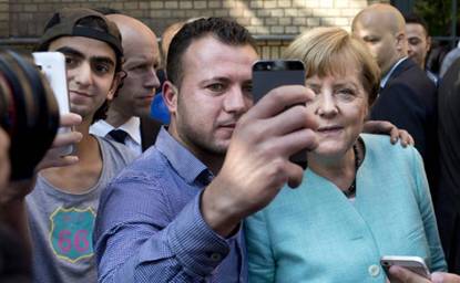 Меркель и мигранты