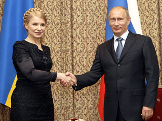 Юлия Тимошенко и Владимир Путин 22 мая 2009 г. в Астане (Фото с сайта Newsru.com)